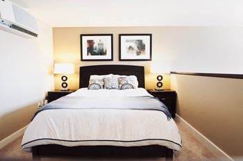 Bedroom with two night tables and wall art